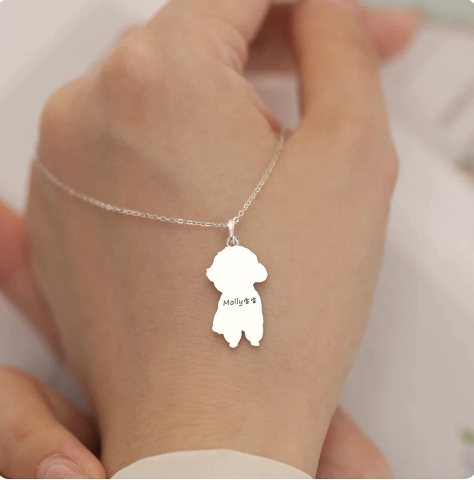 The back of the pet portrait pendant engraved with a pet's name