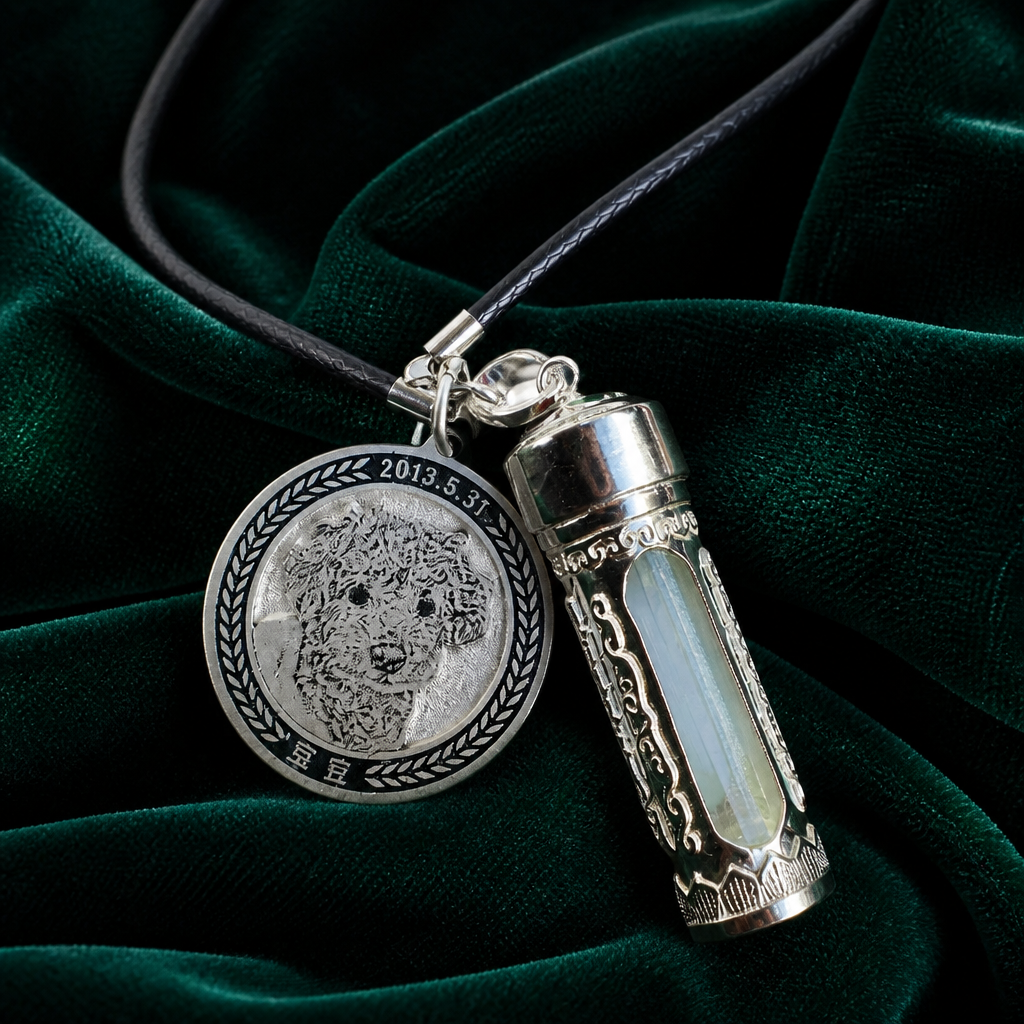 Sterling silver double pendant keepsake — engraved poodle portrait and ornate vial on green velvet